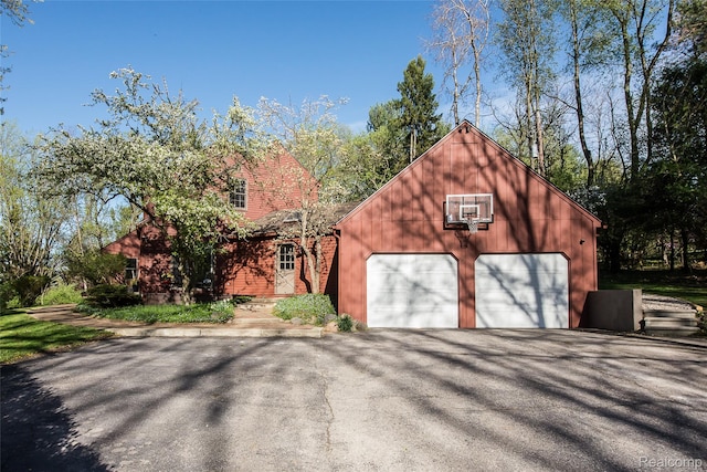 2694 Wayside Dr, Ann Arbor, MI 48103 - garage featuring asphalt driveway