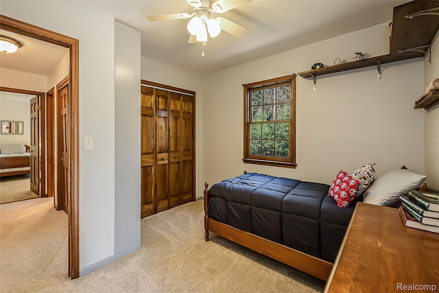 2694 Wayside Dr, Ann Arbor, MI 48103 - bedroom featuring light colored carpet, a closet, and a ceiling fan