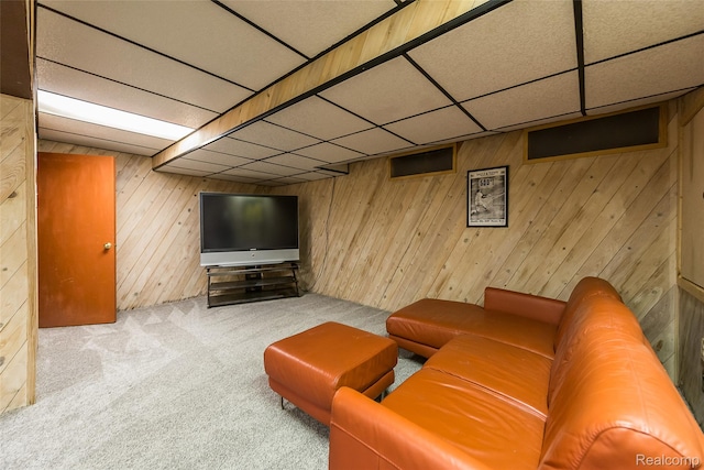 2694 Wayside Dr, Ann Arbor, MI 48103 - living area with a drop ceiling, carpet, and wood walls