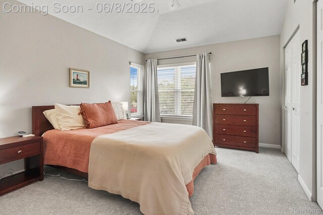 1637 Coburn Dr, Ann Arbor, MI 48108 - bedroom with light colored carpet, vaulted ceiling, and baseboards