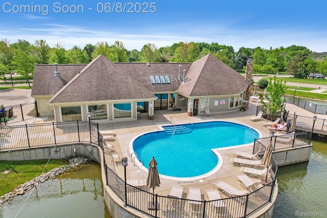 1637 Coburn Dr, Ann Arbor, MI 48108 - community pool with a patio area and view of scattered trees