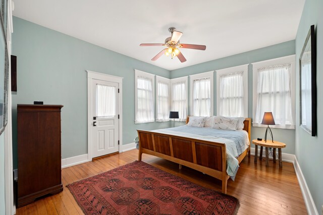 903 Lake Blvd, Saint Joseph, MI 49085 - bedroom with baseboards, light wood-style flooring, and a ceiling fan