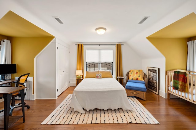903 Lake Blvd, Saint Joseph, MI 49085 - bedroom featuring wood-type flooring, a desk, and lofted ceiling