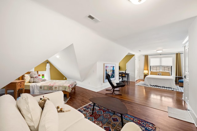 903 Lake Blvd, Saint Joseph, MI 49085 - bedroom with wood finished floors, vaulted ceiling, and baseboards