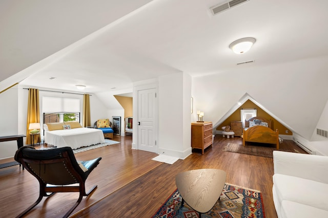 903 Lake Blvd, Saint Joseph, MI 49085 - bedroom featuring vaulted ceiling, wood finished floors, and baseboards