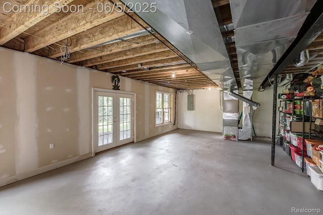 8922 Stonewall W, Clarkston, MI 48348 - below grade area featuring electric panel, heating unit, and french doors
