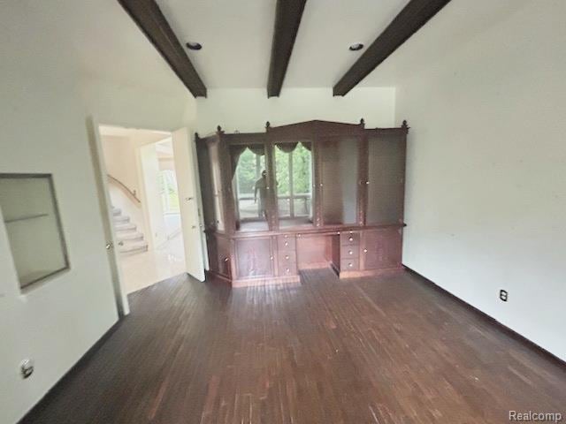 6880 Burtonwood Dr, West Bloomfield, MI 48322 - unfurnished living room with wood finished floors, beam ceiling, and stairway
