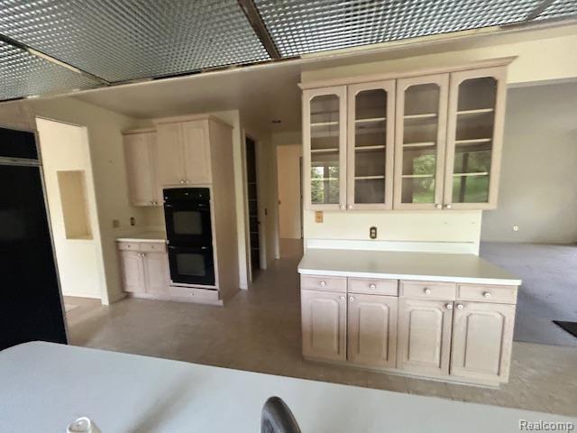 6880 Burtonwood Dr, West Bloomfield, MI 48322 - kitchen with glass insert cabinets and light countertops