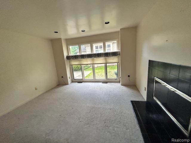 6880 Burtonwood Dr, West Bloomfield, MI 48322 - unfurnished living room with carpet flooring