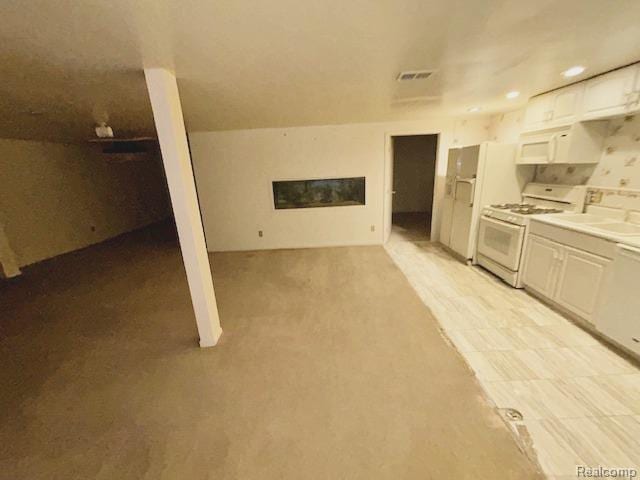 6880 Burtonwood Dr, West Bloomfield, MI 48322 - kitchen featuring white appliances, white cabinetry, light countertops, recessed lighting, and open floor plan