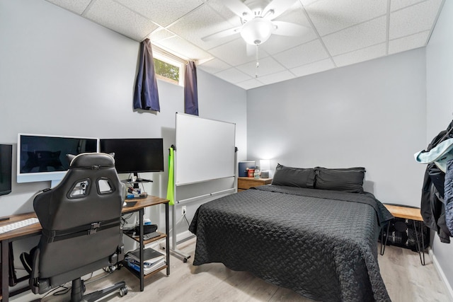 11815 Waldron Rd, Jerome, MI 49249 - bedroom featuring wood finished floors, a drop ceiling, ceiling fan, and an office area