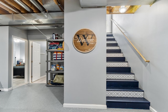 11815 Waldron Rd, Jerome, MI 49249 - staircase featuring baseboards and speckled floor
