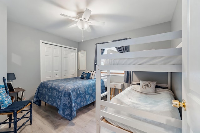11815 Waldron Rd, Jerome, MI 49249 - bedroom with wood finished floors, a closet, and ceiling fan