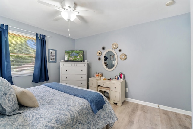 11815 Waldron Rd, Jerome, MI 49249 - bedroom with light wood-type flooring, baseboards, and ceiling fan