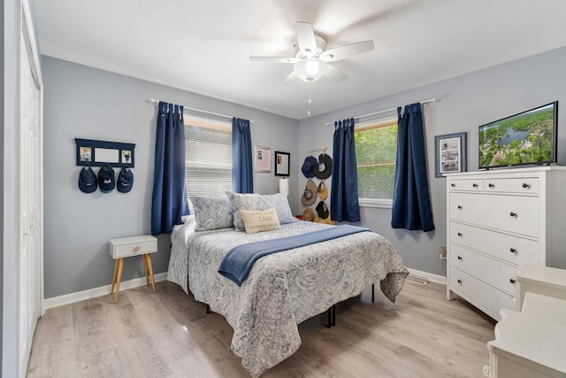 11815 Waldron Rd, Jerome, MI 49249 - bedroom featuring light wood-style floors, baseboards, and a ceiling fan