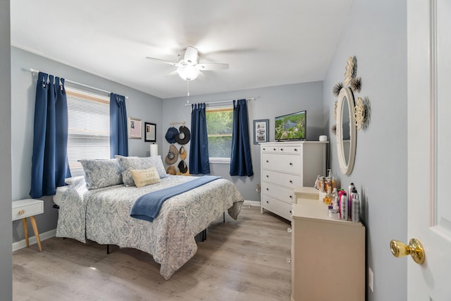 11815 Waldron Rd, Jerome, MI 49249 - bedroom with light wood-style floors, baseboards, and ceiling fan