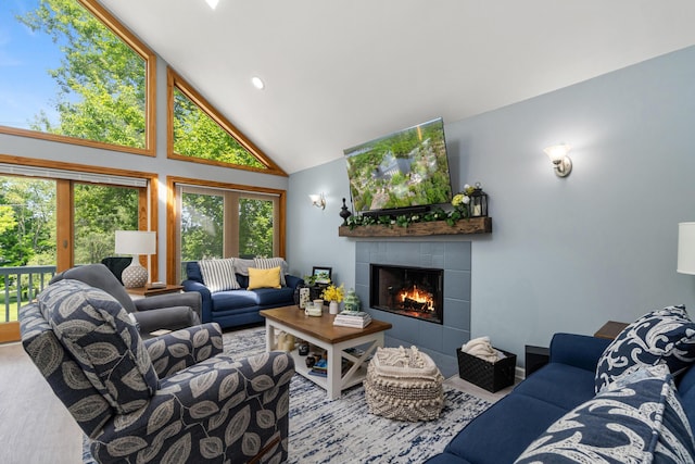 11815 Waldron Rd, Jerome, MI 49249 - living room featuring a tile fireplace and high vaulted ceiling