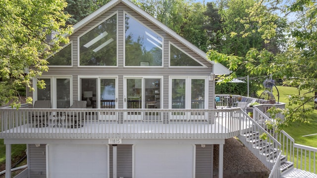 11815 Waldron Rd, Jerome, MI 49249 - rear view of property with an attached garage and a deck