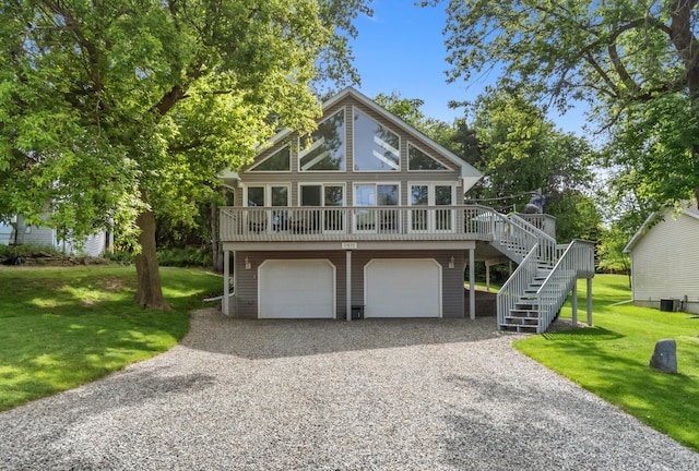 11815 Waldron Rd, Jerome, MI 49249 - view of front facade with driveway, stairs, a front yard, and a garage