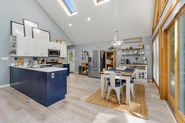 11815 Waldron Rd, Jerome, MI 49249 - kitchen featuring stainless steel appliances, open shelves, high vaulted ceiling, white cabinets, and a peninsula