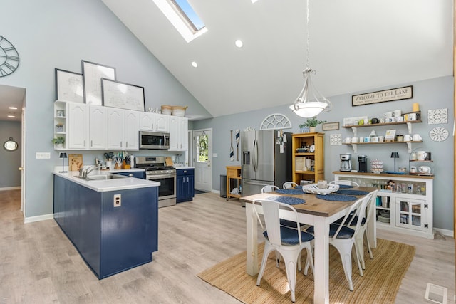 11815 Waldron Rd, Jerome, MI 49249 - kitchen featuring appliances with stainless steel finishes, open shelves, high vaulted ceiling, white cabinetry, and baseboards