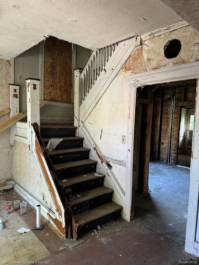 2986 Cadillac Blvd, Detroit, MI 48214 - stairs with a textured ceiling