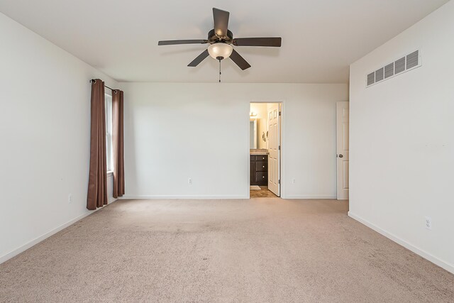 6837 Wellington Dr, Dexter, MI 48130 - empty room with ceiling fan, light colored carpet, and baseboards