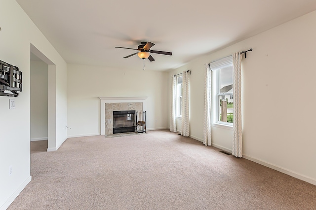6837 Wellington Dr, Dexter, MI 48130 - unfurnished living room with carpet floors, ceiling fan, a fireplace, and baseboards