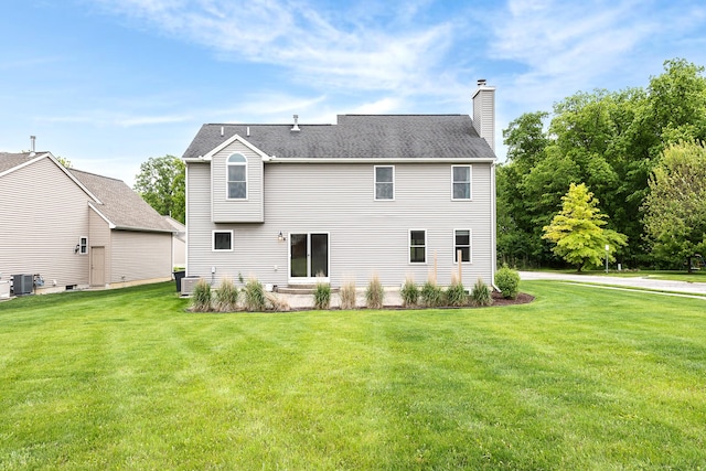 6837 Wellington Dr, Dexter, MI 48130 - back of property with a chimney, a yard, and cooling unit