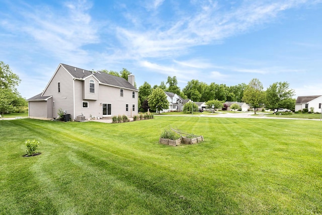 6837 Wellington Dr, Dexter, MI 48130 - view of grassy yard with central AC