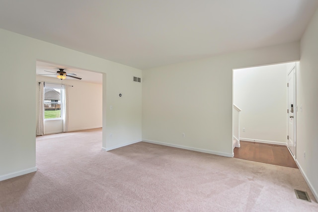 6837 Wellington Dr, Dexter, MI 48130 - empty room featuring carpet, ceiling fan, and baseboards