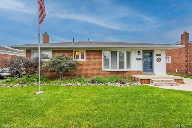 1894 Pinetree Dr, Trenton, MI 48183 - ranch-style house featuring a chimney, brick siding, and a front lawn