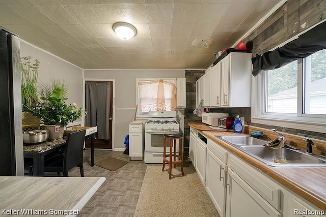 23733 Champaign St, Taylor, MI 48180 - kitchen with white appliances, a sink, ornamental molding, white cabinets, and light countertops