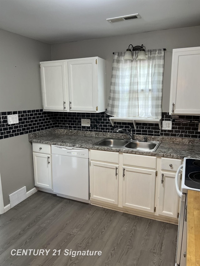 2080 E Schumacher St, Burton, MI 48529 - kitchen with white appliances, a sink, dark wood finished floors, and white cabinetry