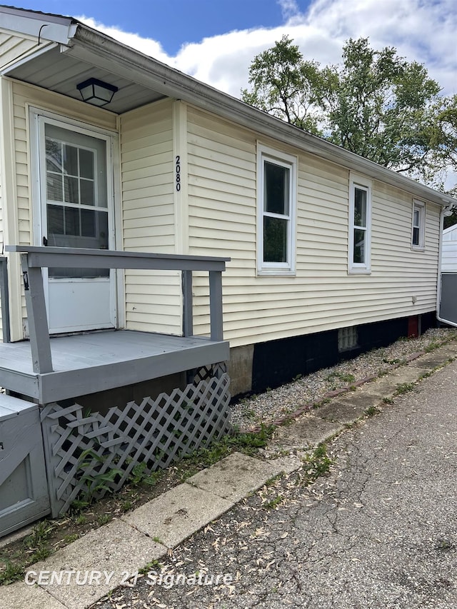 2080 E Schumacher St, Burton, MI 48529 - view of side of property featuring a wooden deck