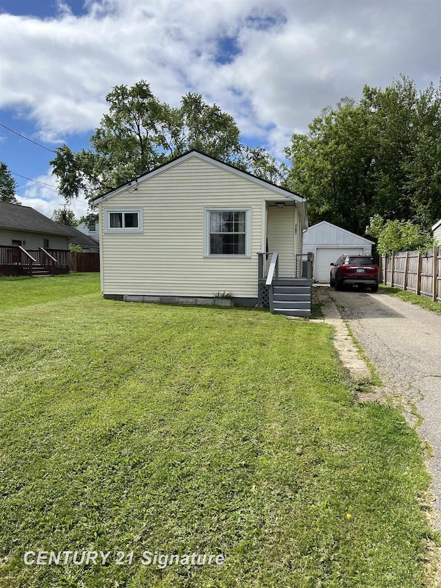 2080 E Schumacher St, Burton, MI 48529 - view of front of home featuring a detached garage and an outbuilding
