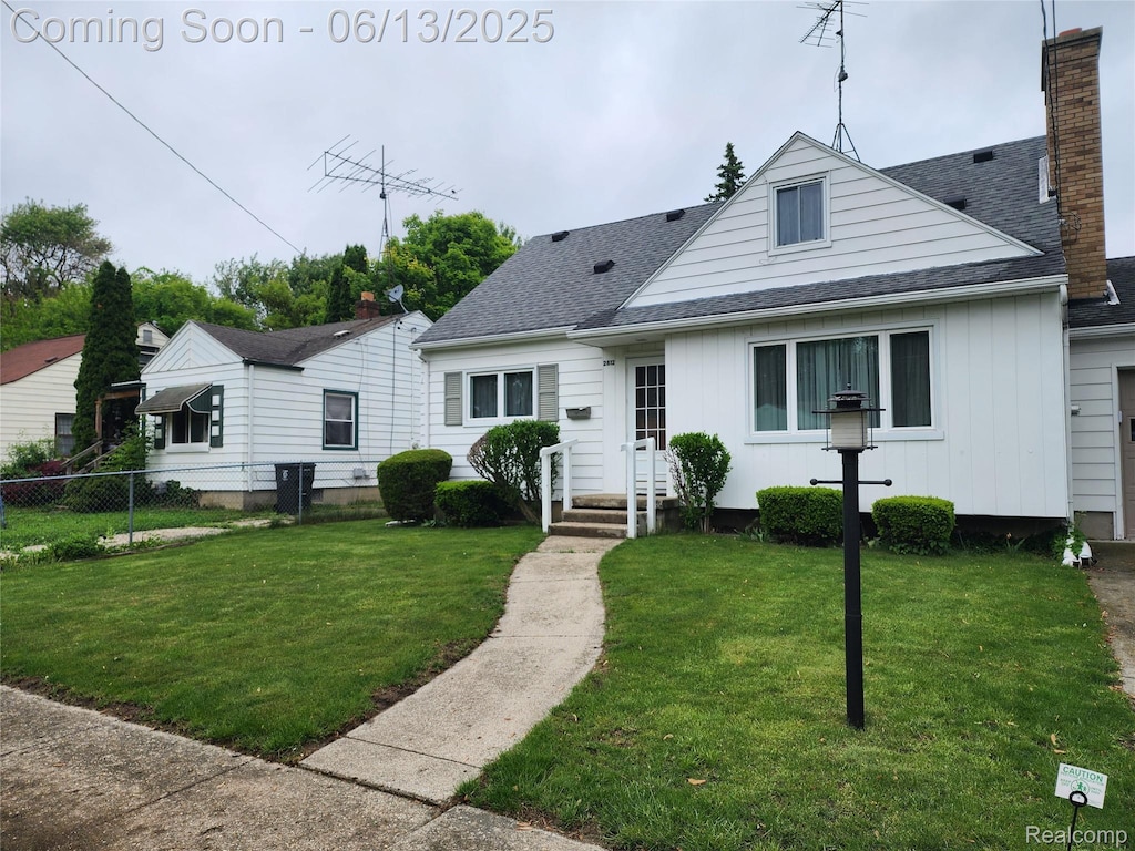 2812 Berkley St, Flint, MI 48504 - bungalow-style house with board and batten siding, roof with shingles, and a chimney