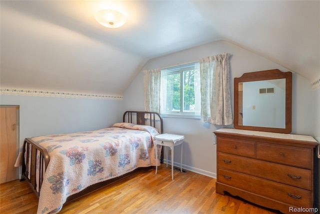 2812 Berkley St, Flint, MI 48504 - bedroom featuring light wood finished floors and lofted ceiling