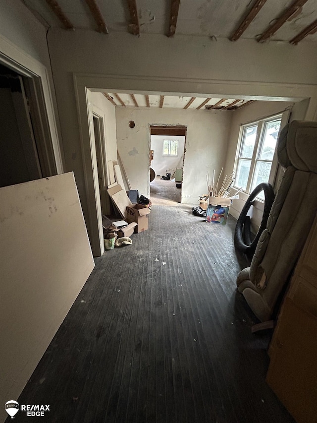 734 Barrie Ave, Flint, MI 48507 - corridor featuring healthy amount of natural light, beamed ceiling, and wood finished floors