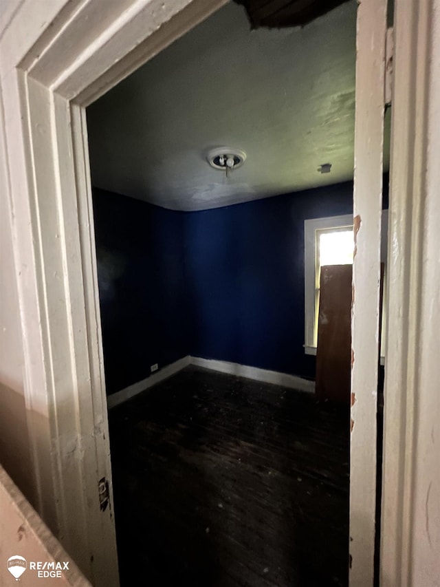 734 Barrie Ave, Flint, MI 48507 - empty room featuring dark wood finished floors and baseboards
