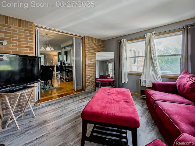 13973 Dixie, Redford, MI 48239 - living area with wood finished floors and brick wall