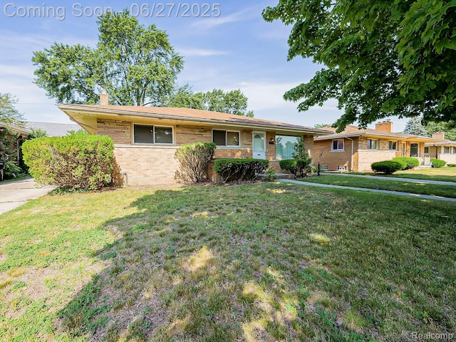 13973 Dixie, Redford, MI 48239 - ranch-style home featuring a chimney, a front lawn, and brick siding