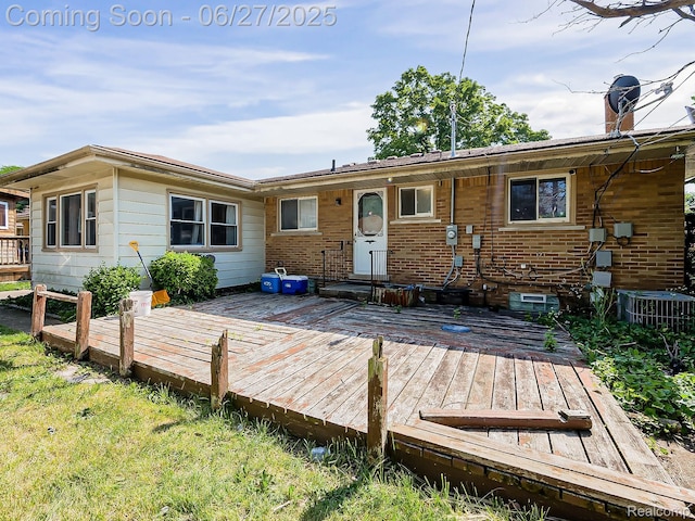 13973 Dixie, Redford, MI 48239 - rear view of house with a wooden deck and brick siding
