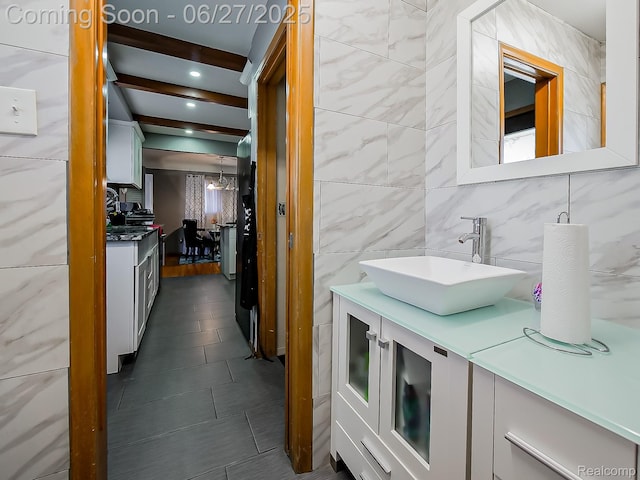 13973 Dixie, Redford, MI 48239 - bathroom with tile walls, vanity, tile patterned floors, beamed ceiling, and tasteful backsplash