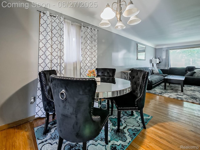 13973 Dixie, Redford, MI 48239 - dining area featuring wood finished floors and a chandelier