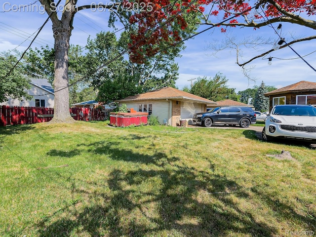 13973 Dixie, Redford, MI 48239 - view of yard with a garage and a hot tub