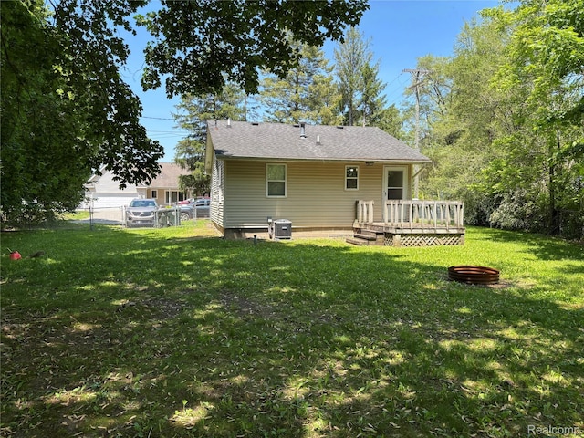 1096 Bayfield St, Lake Orion, MI 48362 - back of house featuring a wooden deck and an outdoor fire pit