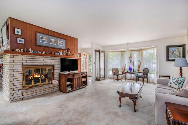 1205 Sassafras Ln, Niles, MI 49120 - carpeted living room featuring a brick fireplace and wood walls