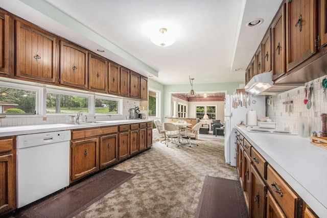 1205 Sassafras Ln, Niles, MI 49120 - kitchen featuring white appliances, decorative backsplash, brown cabinets, and light countertops