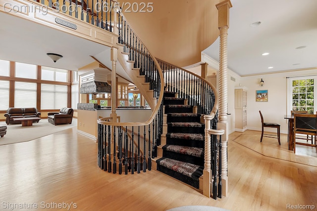 10611 Lighthouse Pt, South Lyon, MI 48178 - stairway with baseboards, wood finished floors, ornamental molding, and recessed lighting